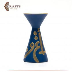 A blue pottery incense burner decorated with Arabic letters