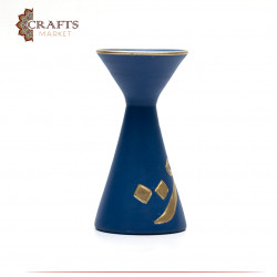 A blue pottery incense burner decorated with Arabic letters
