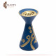 A blue pottery incense burner decorated with Arabic letters