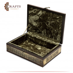 A wooden box decorated with copper and Islamic engravings