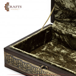 A wooden box decorated with copper and Islamic engravings