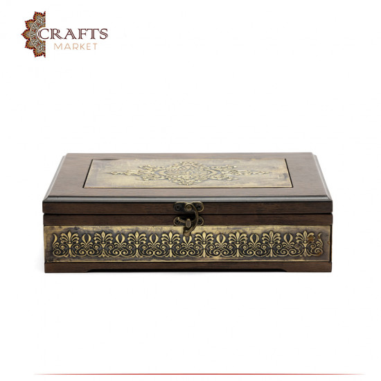 A wooden box decorated with copper and Islamic engravings A wooden box decorated with copper and Islamic engravings