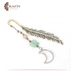 Book separator with a feather design and a crescent-shaped pendant