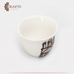  A cup of plain coffee with a drawing of Petra