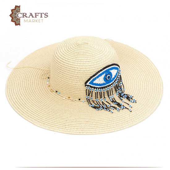 Handmade Beige straw hat with eye and fringe design Handmade Beige straw hat with eye and fringe design